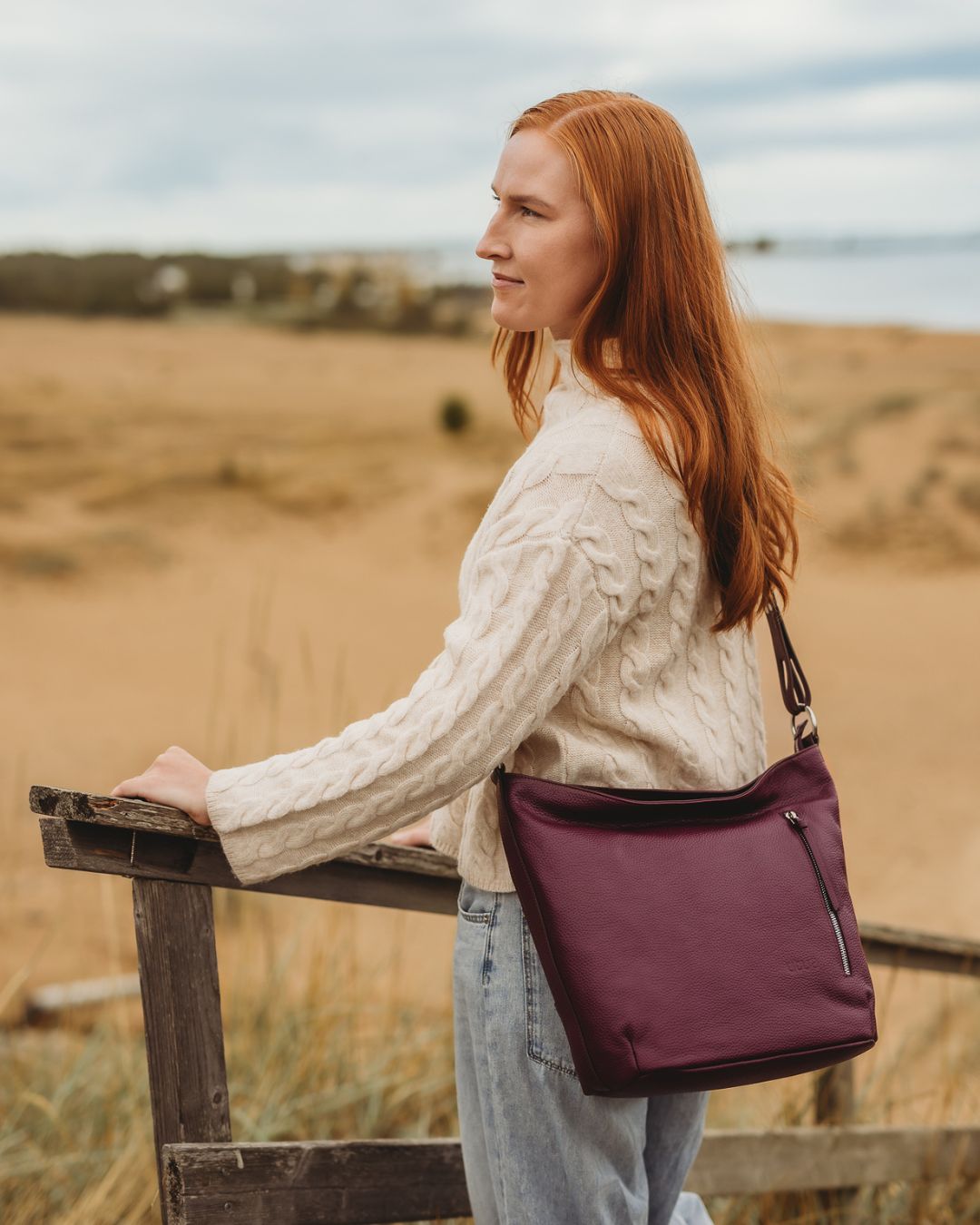 utua roihu musta olkalaukku crossbody
